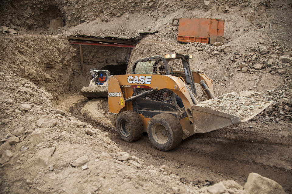 In this photo provided by the regional government of Antofagasta, men use machinery at the San José mine as part of rescue work for the three Bolivian miners trapped deep underground since the night before when it collapsed in Tocopilla, Chile, Friday, June 14, 2019. Local authorities confirmed that the men are alive. (Ricardo Rodriguez/Intendencia de Antofagasta via AP)