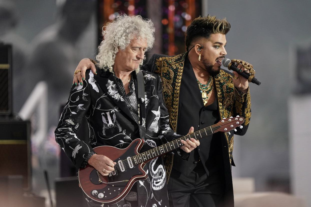 Brian May, left, and Adam Lambert from the band Queen perform at the Platinum Jubilee concert in front of Buckingham Palace in London on Saturday, June 4, 2022, on the third of four days of celebrations to mark the Platinum Jubilee.