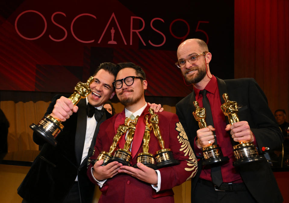 The producer and directors of "Everything Everywhere All at Once" holding their Oscars