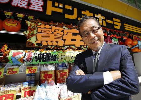 Japanese discount store operator Don Quijote Holdings CEO Takao Yasuda poses for a photo at Don Quijote's central branch store in Tokyo in this September 30, 2014 file photo. REUTERS/Toru Hanai/Files