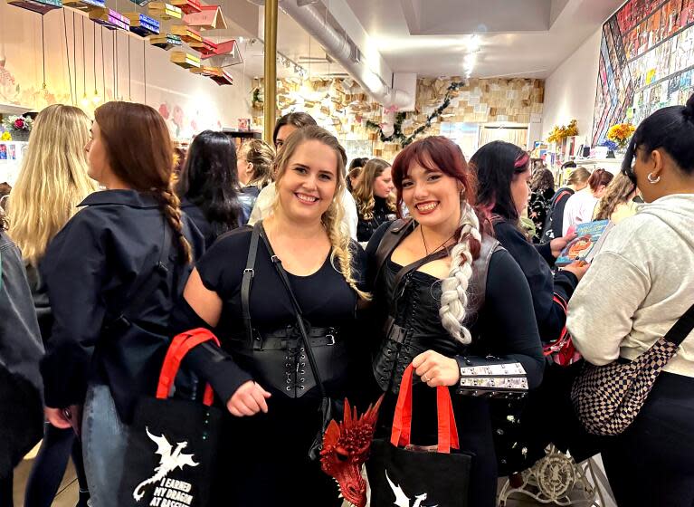CULVER CITY, CALIF. - NOV 6/7, 2023 - Lauren Webster, 31 (left) and Kazmiera Tarshis, 28, of Burbank, cosplay as "Fourth Wing" characters at the midnight book launch of "Iron Flame" at the Ripped Bodice book store in Culver City, Calif. (Jen Yamato / Los Angeles Times)