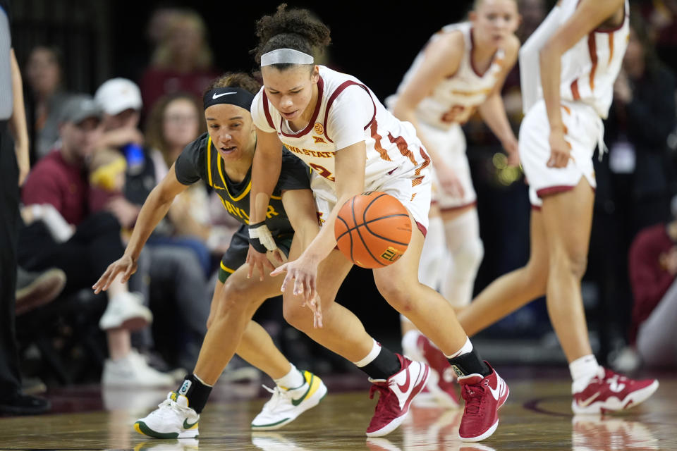 Baylor guard Jada Walker, left, tries to steal the ball from Iowa State guard Arianna Jackson during the first half of an NCAA college basketball game, Saturday, Jan. 13, 2024, in Ames, Iowa. (AP Photo/Charlie Neibergall)