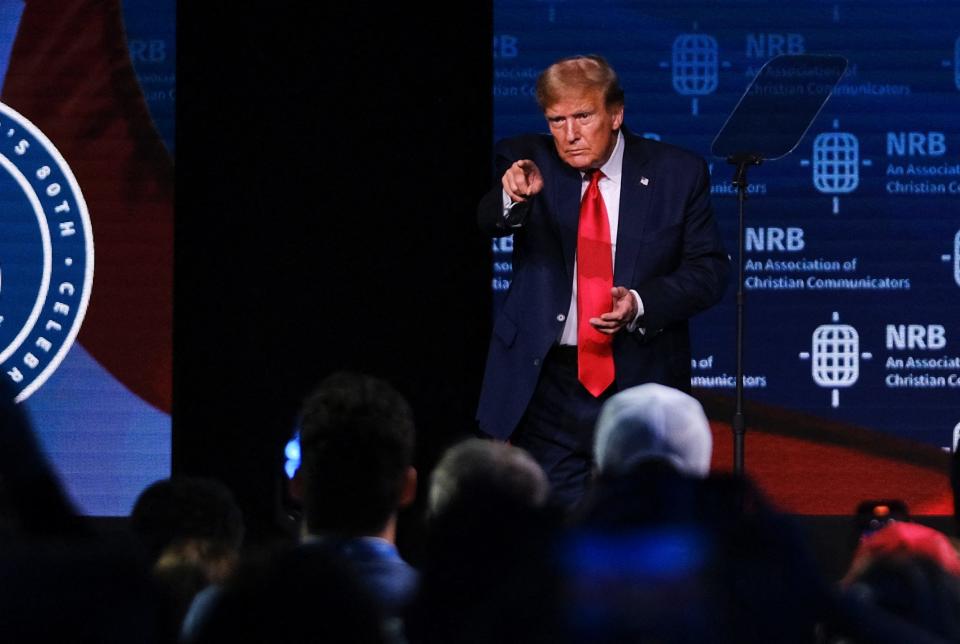 Former US President and 2024 presidential hopeful Donald Trump points as he walks onto stage to address Christian broadcasters at the National Religious Broadcasters (NRB) International Christian Media Convention in Nashville, Tennessee, on February 22, 2024. (Photo by KEVIN WURM / AFP) (Photo by KEVIN WURM/AFP via Getty Images) ORG XMIT: 776108662 ORIG FILE ID: 2023800708