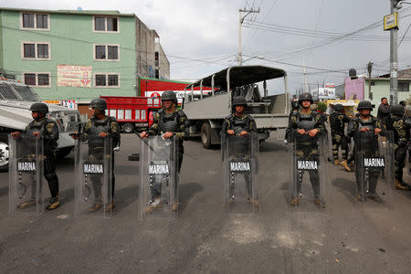 Members of the Mexican Army stand guard in an area after a shootout between gang members and the Mexican army in Mexico City, Mexico July 20, 2017. REUTERS/Carlos Jasso