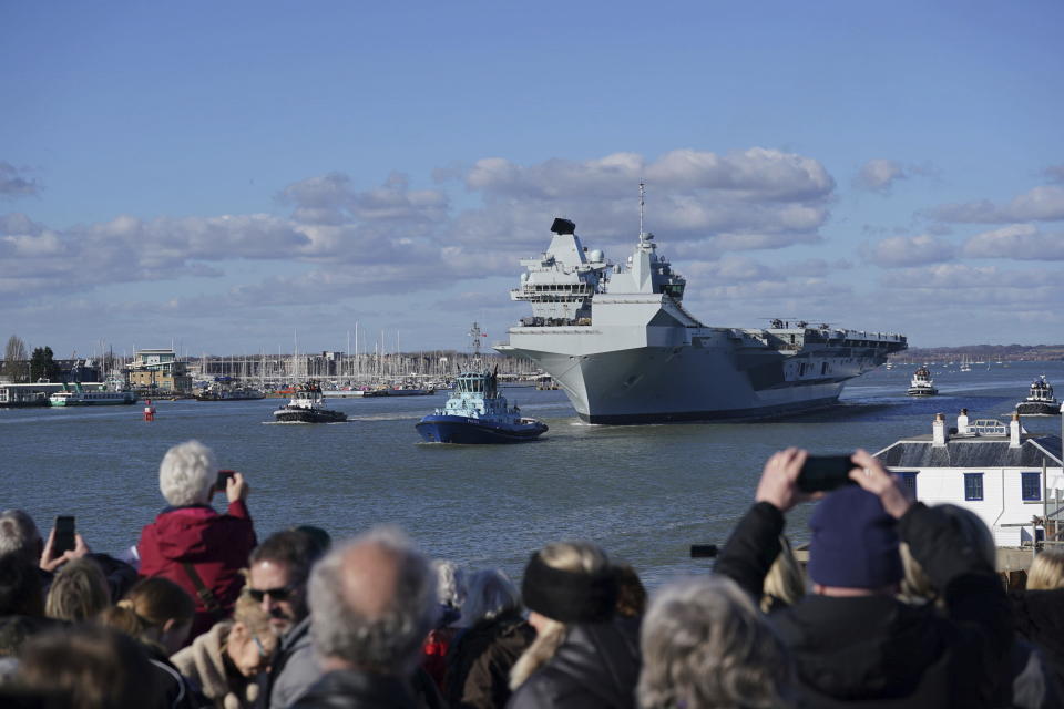 People watch as Royal Navy aircraft carrier HMS Prince of Wales sets sail from Portsmouth to lead the largest Nato exercise since the Cold War. (PA)