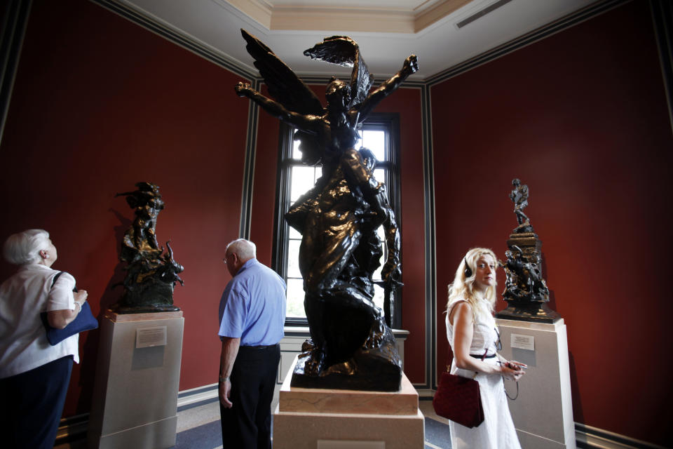 Guest view the newly restored interior of the Rodin Museum, Thursday, July 12, 2012, in Philadelphia. For the first time since the museum opened in 1929, the public will get to see it as its architects intended. The Rodin Museum reopens Friday after a more than three-year, $9 million renovation that returned all its sculptures to their original locations inside and out, refurbished almost all of them. (AP Photo/Brynn Anderson)