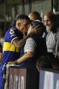 Boca Juniors' Carlos Tevez kisses Gimnasia y Esgrima 's coach Diego Maradona prior to an Argentina's soccer league match at La Bombonera stadium in Buenos Aires, Argentina, Saturday, March 7, 2020. (AP Photo/Natacha Pisarenko)