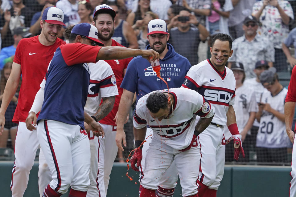 Chicago White Sox's Leury Garcia, center, gets douse with sports drink as the White Sox celebrates his walk-off home run during the ninth inning against the Boston Red Sox of a baseball game, Sunday, Sept. 12, 2021, in Chicago. (AP Photo/David Banks)