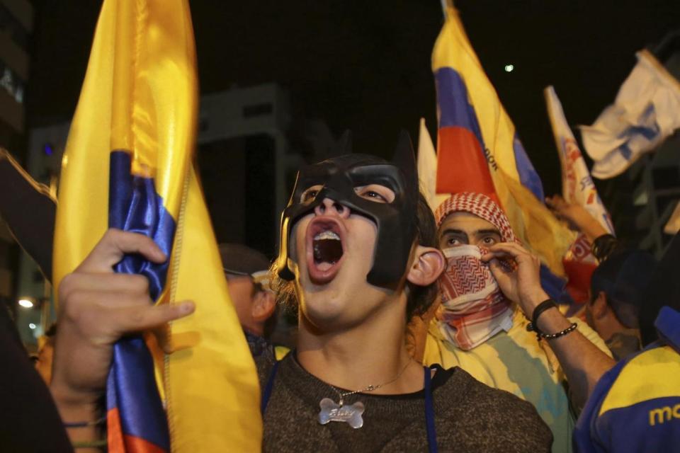 Outrage: Lasso supporters protest near the National Electoral Council after ruling party candidate Lenin Moreno was declared the winner (AP)