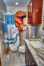 <p>Peeking out from behind the shower curtain. (Photo: Nebraska Realty/Caters News) </p>