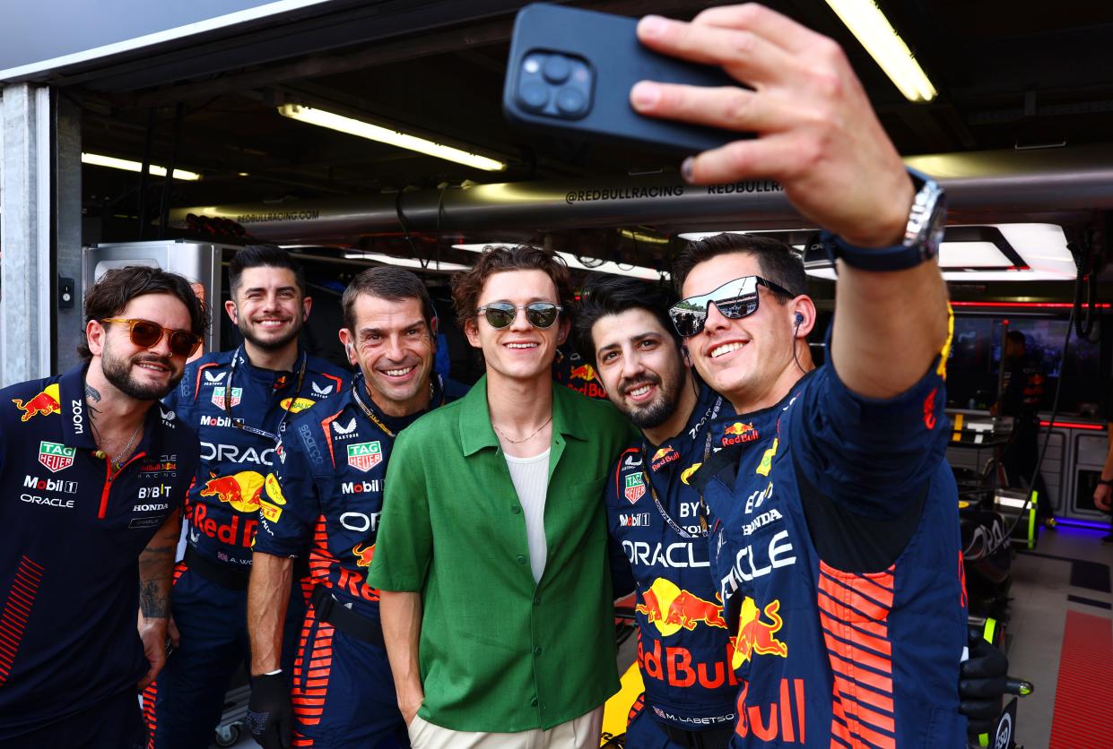 Tom Holland (center) poses for a photo with Red Bull Racing team members during the F1 Grand Prix of Monaco at Circuit de Monaco on Sunday.