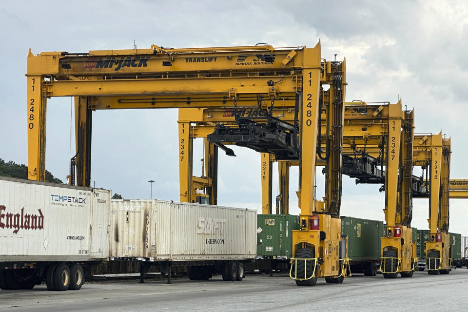 A line of semi truck trailers waits to be pulled away from a Norfolk Southern rail yard in the Atlanta area after being unloaded from a train on June 20, 2023. (AP Photo/Josh Funk)