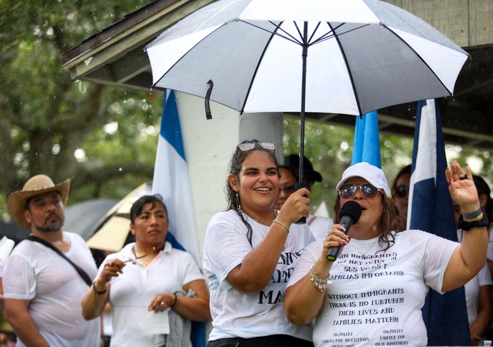 Sonimary Torres, left, and Katty Beniquez speak during a demonstration in Vero Beach's Riverside Park on Thursday, June 1, 2023, opposing Senate Bill 1718, which was signed into law by Gov. Ron DeSantis,  The demonstration, organized by leaders of the Ministerio Cristiano Oasis de Bendicion, a church in Indian River County, voiced their concerns with the law that takes effect July 1. Vero Beach was one of six cities statewide where opponents to Florida's new immigration law held rallies Thursday. The law impacts immigrants' employment, health care and the process of obtaining identification documents.