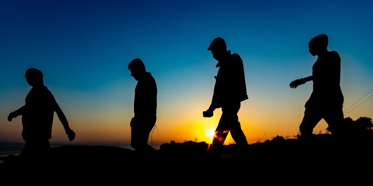 Afghanistan refugees walking at dawn