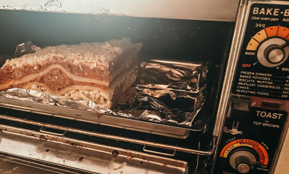 piece of frozen lasagna in a toaster oven