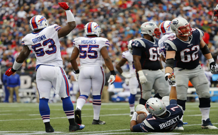 Oct 2, 2016; Foxborough, MA, USA; New England Patriots quarterback Jacoby Brissett (7) is helped up by offensive guard Joe Thuney (62) after being sacked by Buffalo Bills inside linebacker Zach Brown (53) during the second half of the Buffalo Bills 16-0 win over the New England Patriots at Gillette Stadium. Mandatory Credit: Winslow Townson-USA TODAY Sports