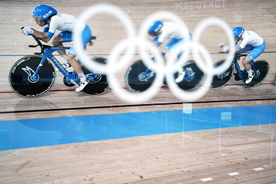 Members of the Italian women's track cycling team round the track during a training session inside the Izu velodrome at the 2020 Summer Olympics, Thursday, July 29, 2021, in Tokyo, Japan. (AP Photo/Thibault Camus)