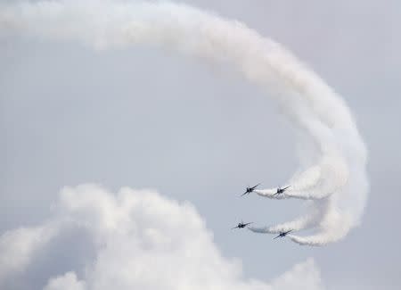 South Korea's Black Eagles aerobatics team perform a maneuver during a preview of the Singapore Airshow at Changi exhibition center in Singapore February 14, 2016. The airshow will take place from February 16-21. REUTERS/Edgar Su