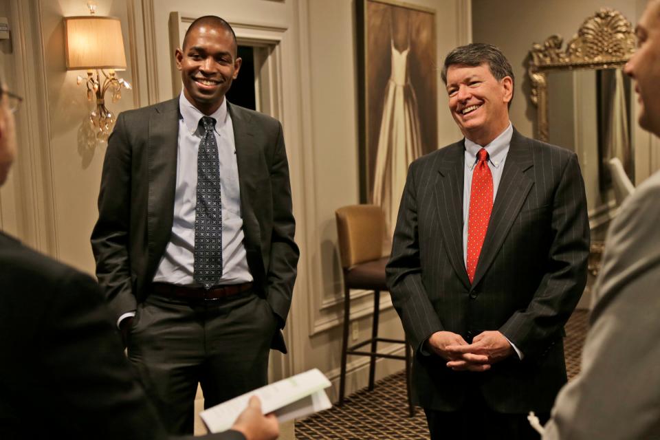 Republican U.S. Rep. John Faso, right, and his Democratic challenger, Antonio Delgado, establish ground rules before the start of a candidate forum in Poughkeepsie, N.Y., Wednesday, Oct. 17, 2018.