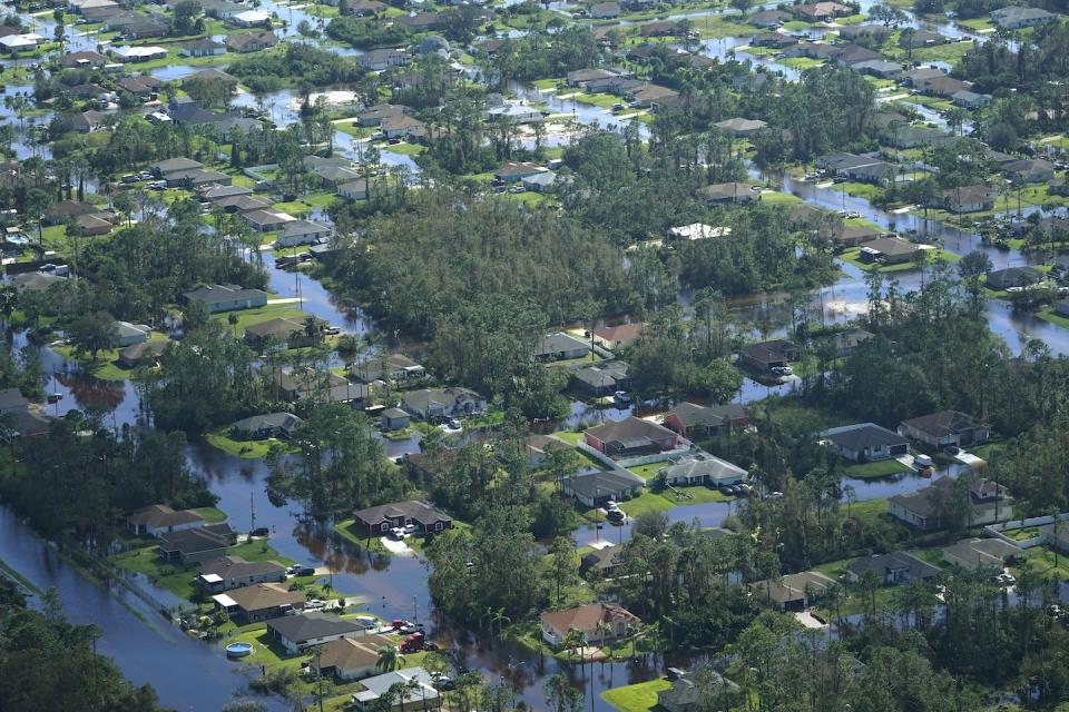 The day after Hurricane Ian made landfall, homes were surrounded by water in Fort Myers, Fla. <a href="https://newsroom.ap.org/detail/TropicalWeather10Wetter/572032a91f1d4cab9487bfb47f6f926f/photo" rel="nofollow noopener" target="_blank" data-ylk="slk:AP Photo/Marta Lavandier;elm:context_link;itc:0;sec:content-canvas" class="link ">AP Photo/Marta Lavandier</a>