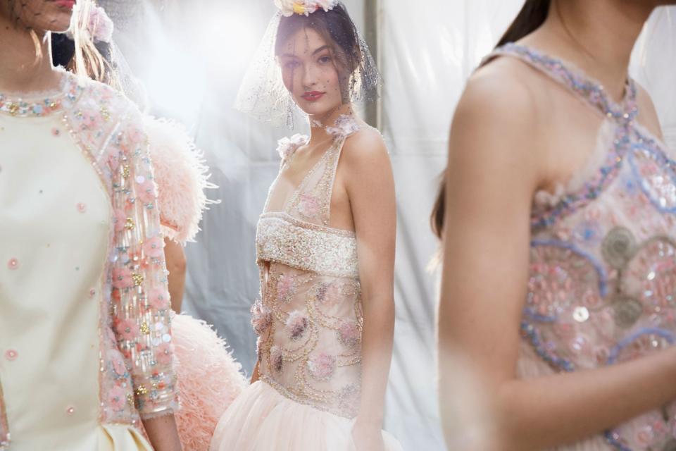 This shimmering Chanel couture look has a whopping 123,670 embellishments—and that doesn’t even include the boots. Here, the house shares exclusive details and images of how the dress was made.