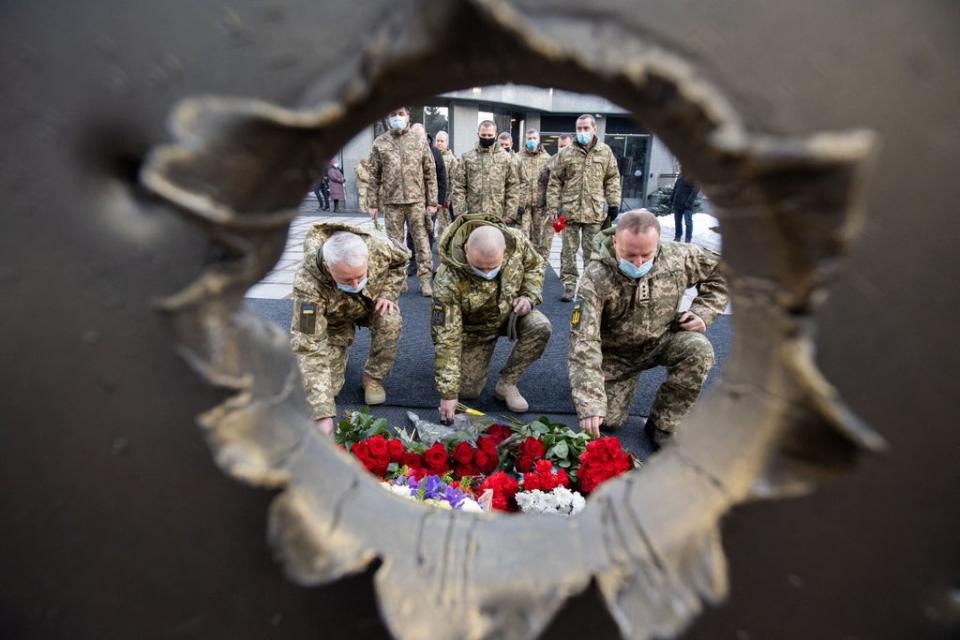 A ceremony in tribute to fallen defenders of Ukraine (via Reuters)