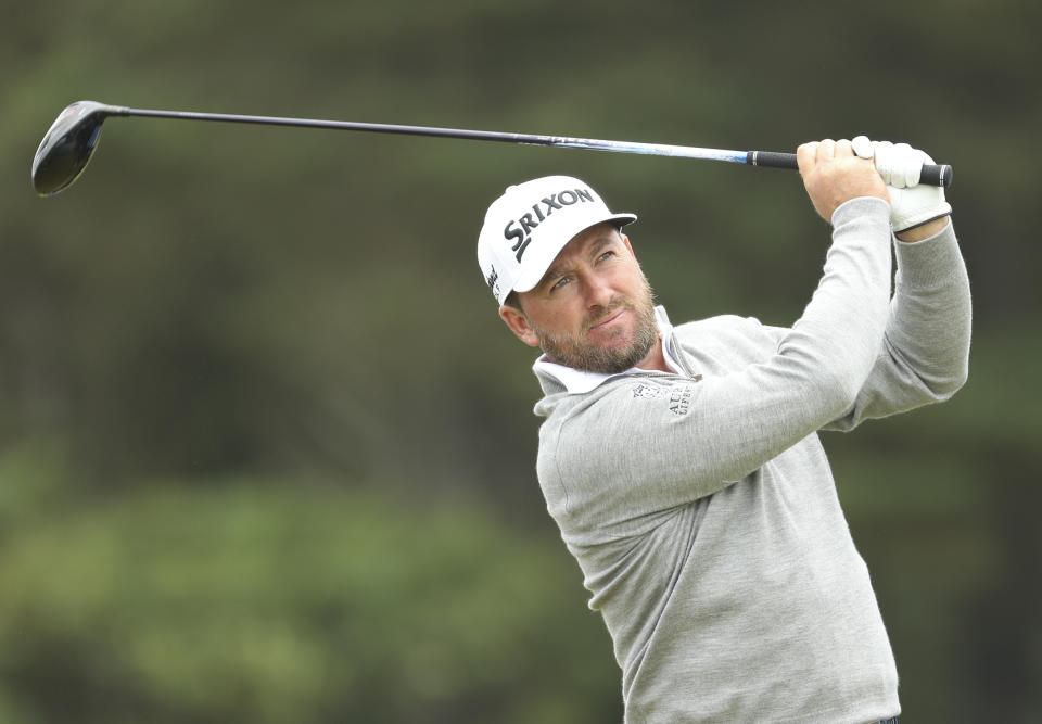 Northern Ireland's Graeme McDowell hits his net shot off the 12th during a practice round ahead of the start of the British Open golf championships at Royal Portrush in Northern Ireland, Wednesday, July 17, 2019. The British Open starts Thursday. (AP Photo/Peter Morrison)