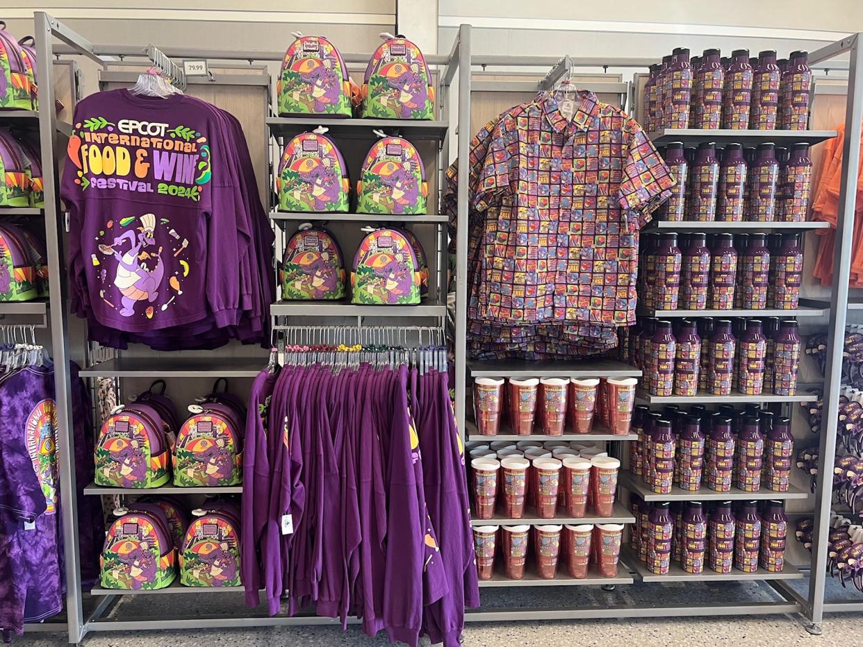 Figment adorns a variety of EPCOT International Food & Wine festival merchandise inside CommuniCore Hall.