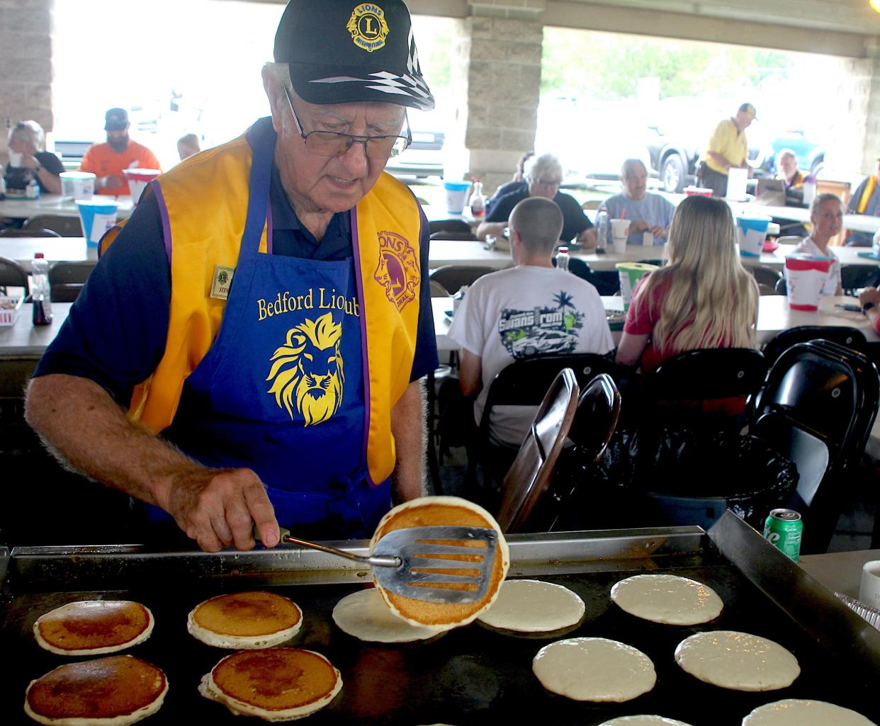 Bedford Lion's Club member Steve Warren flips flapjacks during the 73rd annual Bedford Lion's Club Pancake Festival Saturday, May 4, 2024, at the Thornton Park Pavilion.