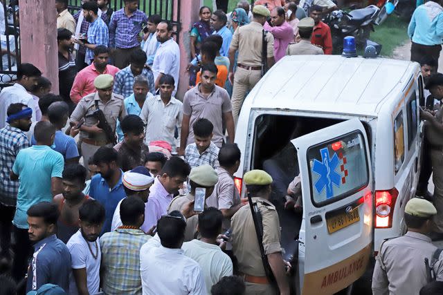 <p>AP Photo/Manoj Aligadi</p> An ambulance with injured people in the Hathras district