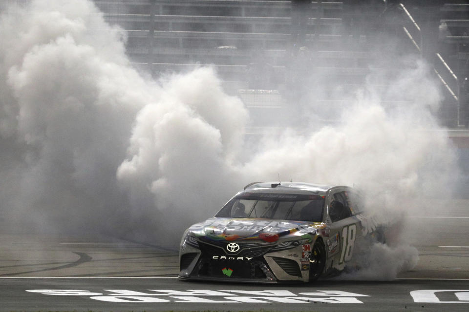 Kyle Busch does doughnuts after winning the NASCAR Cup Series auto race at Texas Motor Speedway in Fort Worth, Texas, Wednesday, Oct. 28, 2020. (AP Photo/Richard W. Rodriguez)