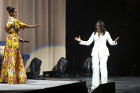 Tracee Ellis Ross, left, introduces former first lady Michelle Obama at the "Becoming: An Intimate Conversation with Michelle Obama" event at the Forum on Thursday, Nov. 15, 2018, in Inglewood, Calif. (Photo by Willy Sanjuan/Invision/AP)