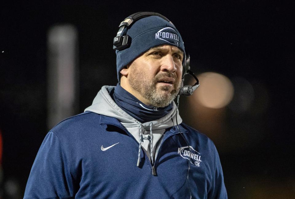 McDowell head coach Brad Orlando looks on during the second quarter of a PIAA Class 6A quarterfinal football game on Friday at Mt. Lebanon High School in Pittsburgh. The Trojans lost to the Blue Devils 47-14.