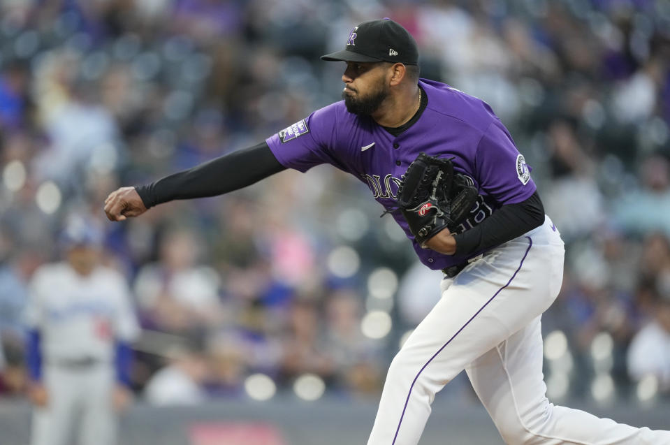 Colorado Rockies starting pitcher German Marquez works against the Los Angeles Dodgers in the first inning of a baseball game Wednesday, Sept. 22, 2021, in Denver. (AP Photo/David Zalubowski)