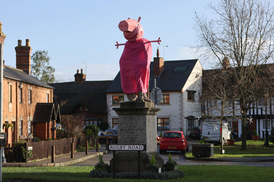 A village is hunting festive pranksters who have turned a statue of its most famous son into PEPPA PIG. The statue of Lord John Scott, who died in 1860, is a Christmas target for jokers in Dunchurch, near Rugby, Warks. Hilarious pictures show the monument draped in a pink sheet with arms stretched out and a huge pink papier mache head resembling kids' TV favourite. The statue has previously been turned into Harry Potter, Shrek, Happy Feet, Pikachu, Homer Simpson, an Olympic athlete and The Grinch in an annual tradition dating back to the 1970s.