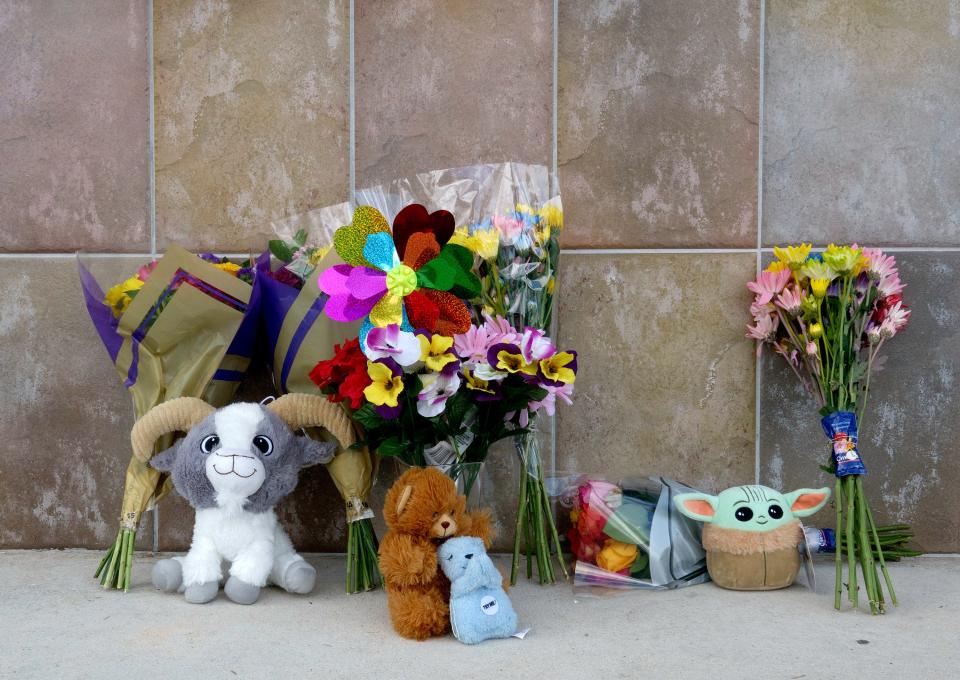 A small memorial is set up at the Publix in Royal Palm Beach Friday morning, June 11, 2021, where a man shot and killed a woman and her grandson Thursday before killing himself. 