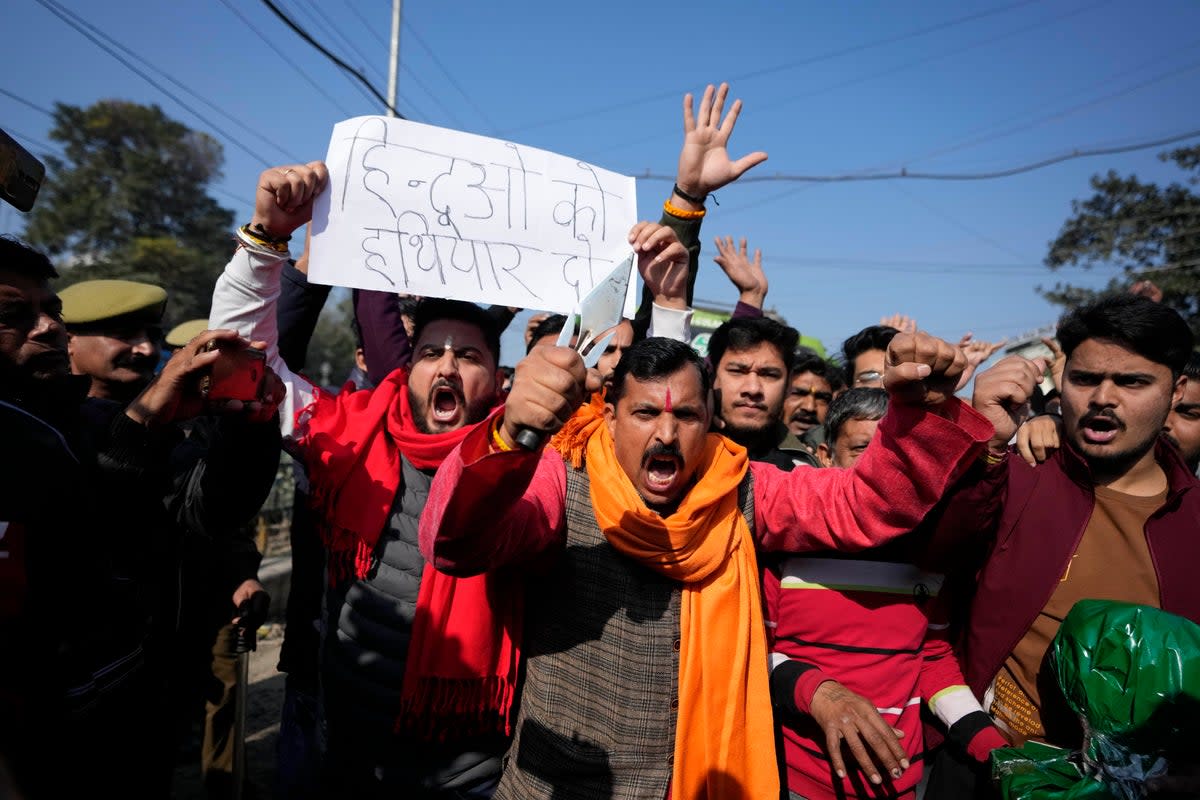 Activists of right wing Hindu group Rashtriya Bajrang Dal, reacting to the militant attack in the southern Rajouri district of Indian-controlled Kashmir shout slogans during a protest in Jammu (AP)