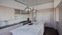 <p>There’s also an ultra-modern kitchen with a massive centre island. (TMZ) </p>