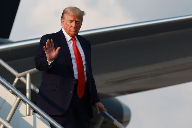 <p> Joe Raedle/Getty</p> Former U.S. President Donald Trump arrives at Atlanta Hartsfield-Jackson International Airport on August 24, 2023