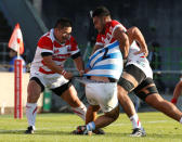 Rugby Union - Rugby Test -Japan v Argentina - Prince Chichibu Memorial Stadium, Tokyo, Japan - 05/11/16Argentina's Agustin Creevy (C) is blocked by Japan' Kotaro Matsushima (R) and Satoshi Nakatani. REUTERS/Kim Kyung-Hoon