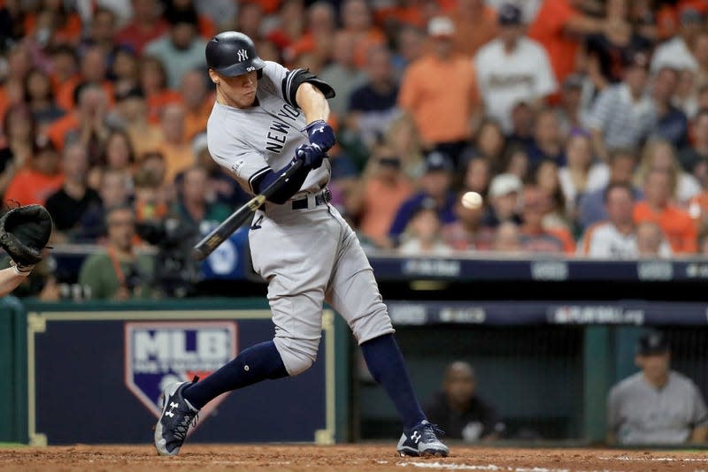  Aaron Judge #99 of the New York Yankees hits a solo home run against Brad Peacock #41 of the Houston Astros during the eighth inning in Game Six of the American League Championship Series at Minute Maid Park on October 20, 2017 in Houston, Texas. 