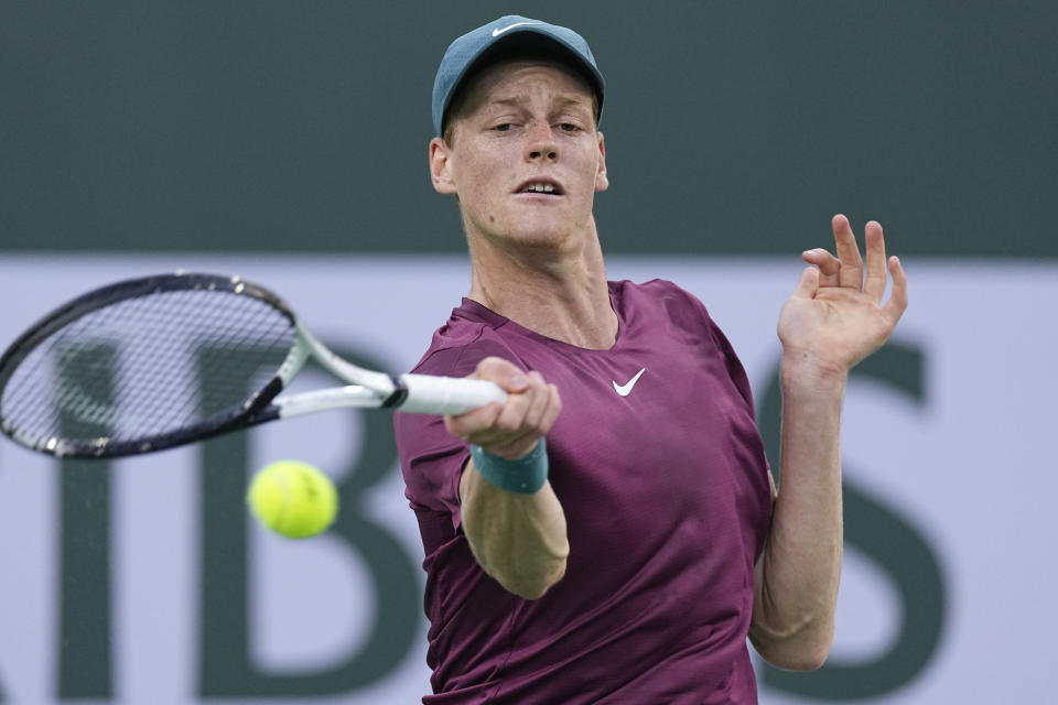 Jannik Sinner, of Italy, returns to Taylor Fritz at the BNP Paribas Open tennis tournament Thursday, March 16, 2023, in Indian Wells, Calif. (AP Photo/Mark J. Terrill)