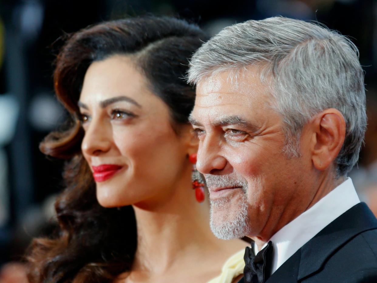 George and Amal Clooney, seen here at the Cannes film festival in May 2016, have pledged $1 million to the Southern Poverty Law Center: REUTERS/Regis Duvignau