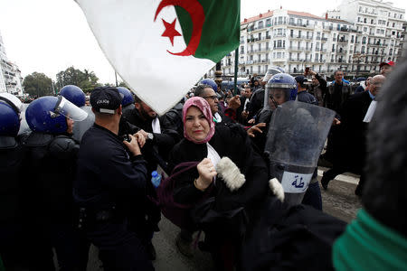 Police try to disperse lawyers marching during a protest to demand the immediate resignation of President Abdelaziz Bouteflika, in Algiers, Algeria March 23, 2019. REUTERS/Ramzi Boudina