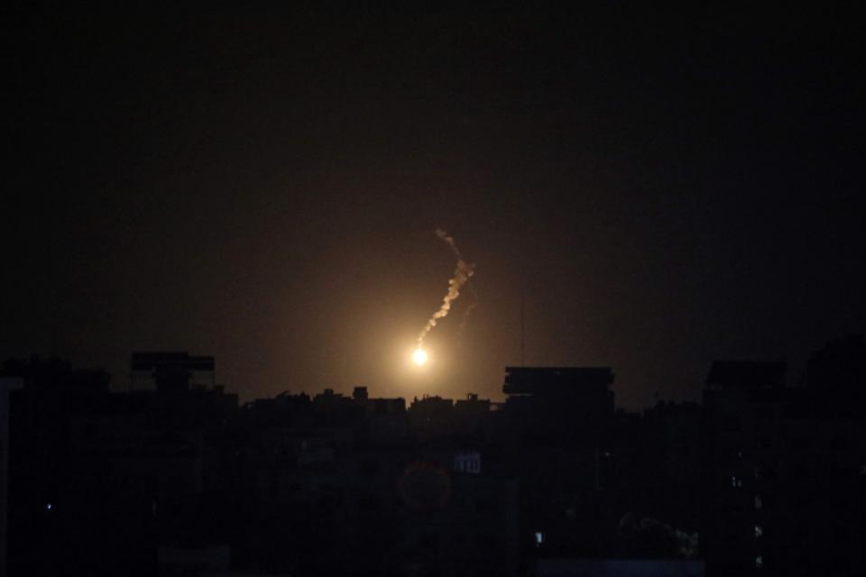 A flares lights the sky moments before an Israeli air strike on Gaza City late on Nov. 2, 2023, amid the ongoing battles between Israel and the Palestinian group Hamas. Thousands of civilians, both Palestinians and Israelis, have died since Oct. 7, 2023, after Palestinian Hamas militants based in the Gaza Strip entered southern Israel in an unprecedented attack triggering a war declared by Israel on Hamas with retaliatory bombings on Gaza.