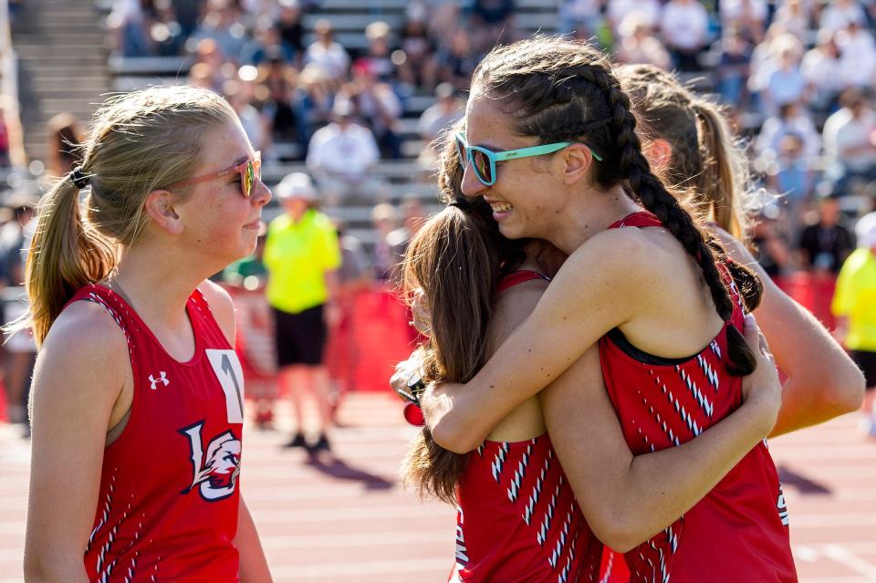 Liberty Common's Isabel Allori celebrates with relay teammates Ella Howe, Ali Gomez and Grace Berkhausen after winning the 4x800 during the Colorado track and field state championships on Thursday, May 16, 2024 at Jeffco Stadium in Lakewood, Colo.