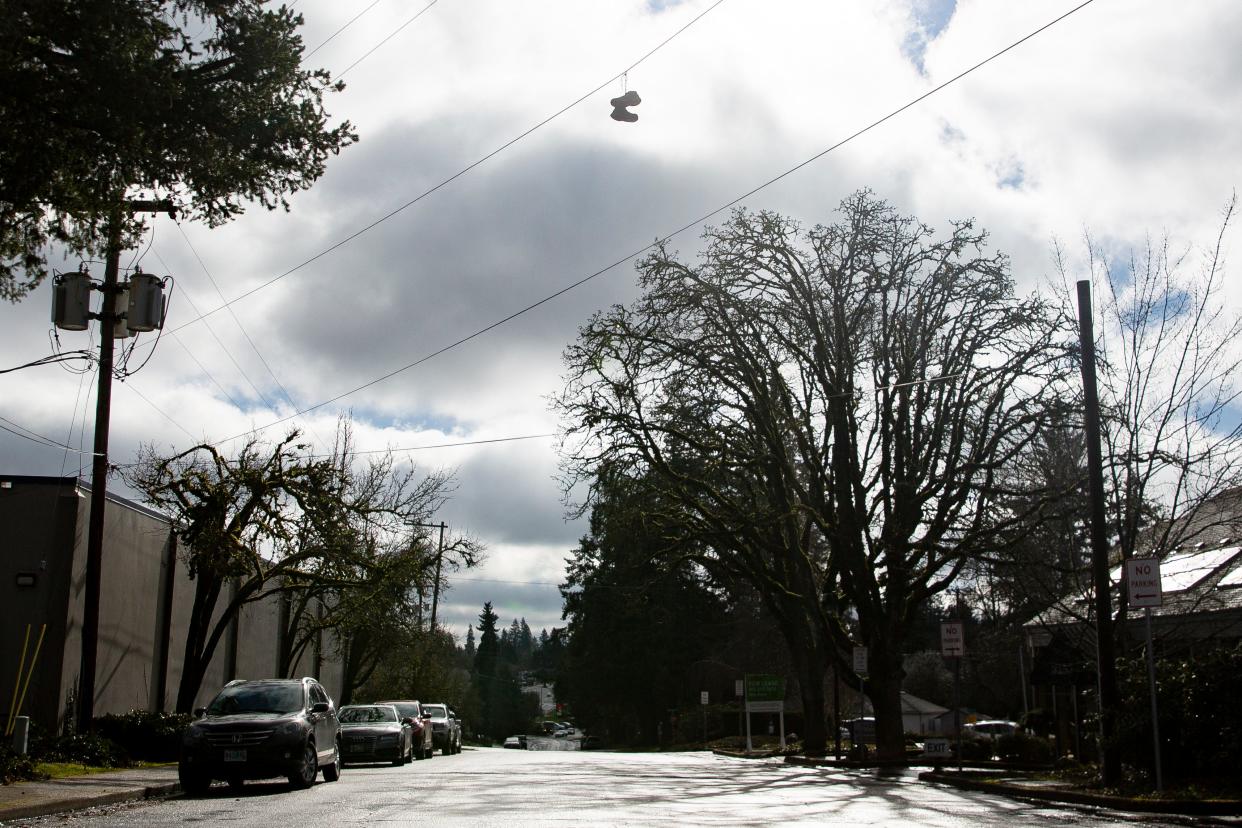 A pair of shoes dangles from a utility line on Triangle Drive SE on Feb. 19 in Salem.