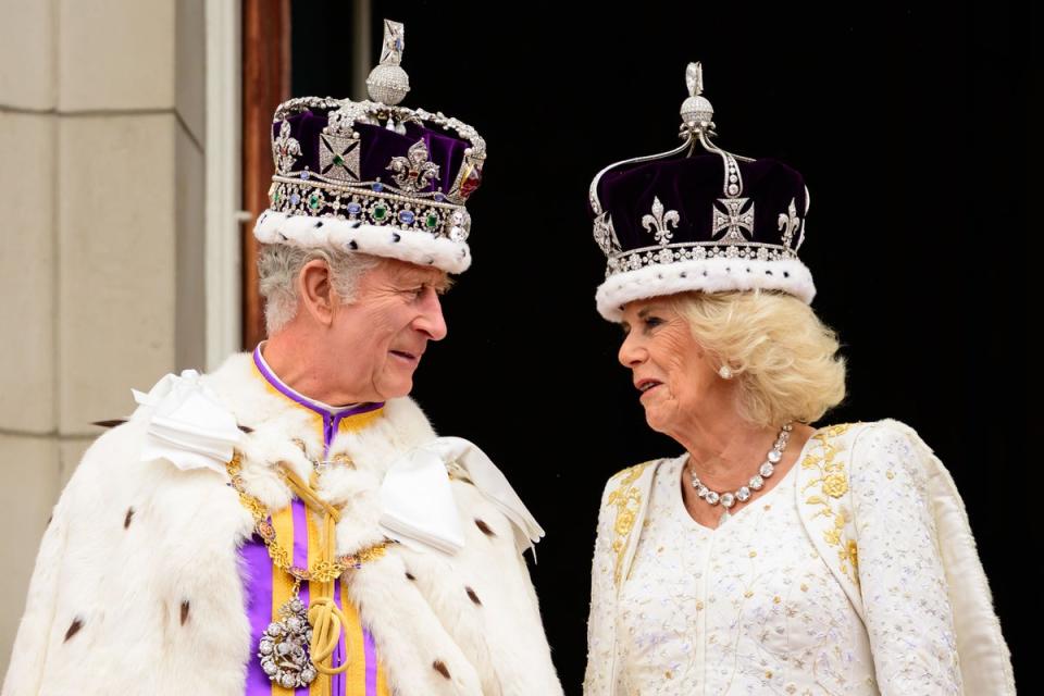 King Charles III and Queen Camilla on the balcony of Buckingham Palace following the coronation (Leon Neal/PA) (PA Archive)