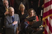 House Speaker Nancy Pelosi and Senate Majority Leader Mitch McConnell of Ky., join Congressional leadership and other members of Congress at a Congressional Gold Medal ceremony honoring amyotrophic lateral sclerosis (ALS) advocate and former National Football League (NFL) player, Steve Gleason, in Statuary Hall on Capitol Hill, Wednesday, Jan. 15, 2020, in Washington. (AP Photo/Manuel Balce Ceneta)