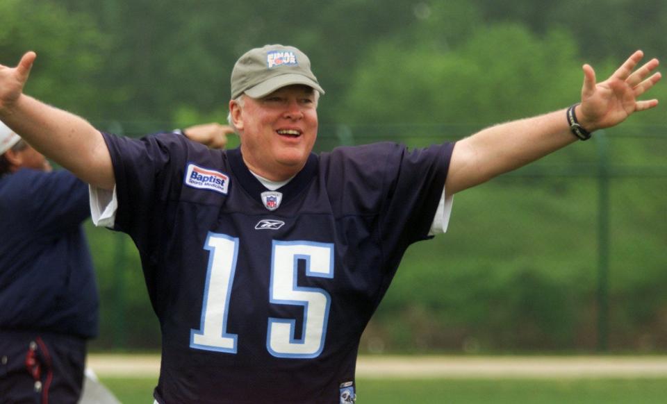 Tennessean sport columnist Joe Biddle cheers after he blocks for the punter at the Titans media minicamp on May 2, 2002.